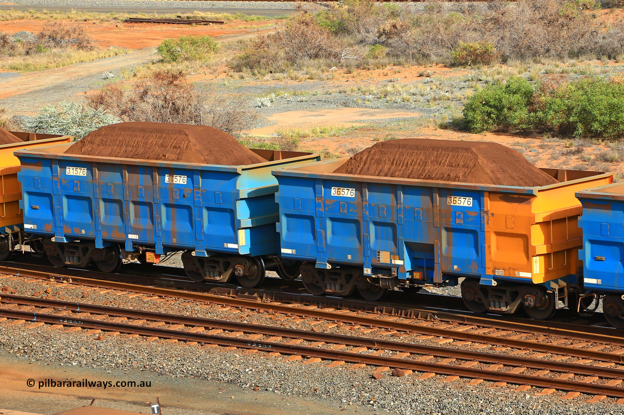 240619 0341
Cape Lambert yard, one of Rio Tinto's blue rakes with spring park brake and only electronic controlled pneumatic [ECP] braking, waggon pair 31576 is a master and is bar coupled to slave waggon 36576 built by China Northen as a Q type in 12/2022. Captured on June 19, 2024.
Keywords: 31576;36576;Q-type;China-Northern;Rio-ore-waggon;