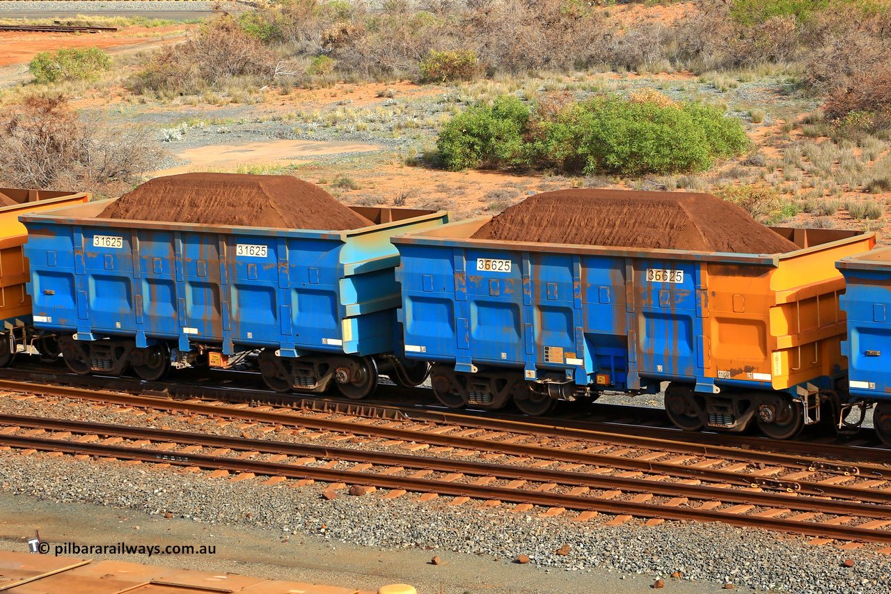 240619 0343
Cape Lambert yard, one of Rio Tinto's blue rakes with spring park brake and only electronic controlled pneumatic [ECP] braking, waggon pair 31625 is a master and is bar coupled to slave waggon 36625 built by China Northen as a Q type in 11/2022. Captured on June 19, 2024.
Keywords: 31625;36625;Q-type;China-Northern;Rio-ore-waggon;