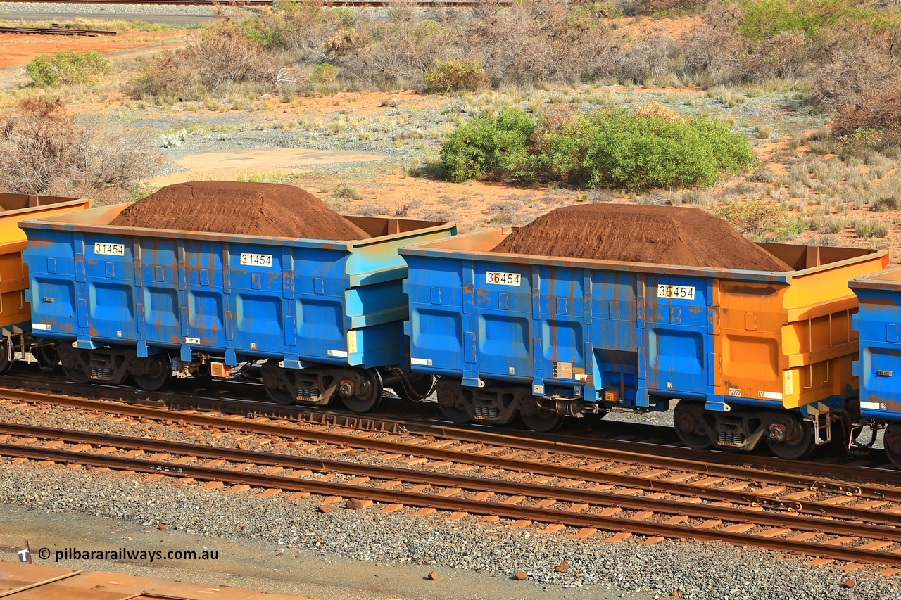 240619 0346
Cape Lambert yard, one of Rio Tinto's blue rakes with spring park brake and only electronic controlled pneumatic [ECP] braking, waggon pair 31454 is a master and is bar coupled to slave waggon 36454 built by China Northen as a Q type in 12/2022. Captured on June 19, 2024.
Keywords: 31454;36454;Q-type;China-Northern;Rio-ore-waggon;