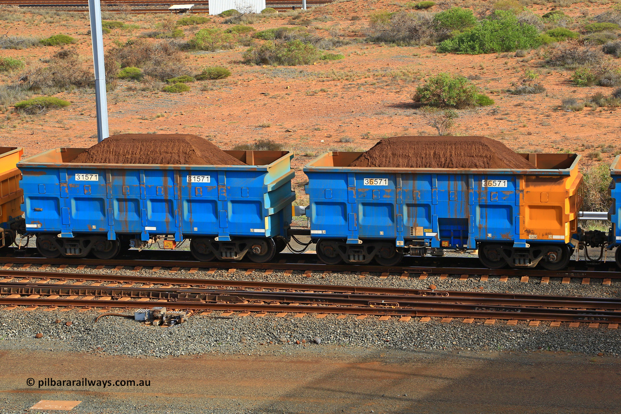 240619 0350
Cape Lambert yard, one of Rio Tinto's blue rakes with spring park brake and only electronic controlled pneumatic [ECP] braking, waggon pair 31571 is a master and is bar coupled to slave waggon 36571 built by China Northen as a Q type in 12/2022. Captured on June 19, 2024.
Keywords: 31571;36571;Q-type;China-Northern;Rio-ore-waggon;