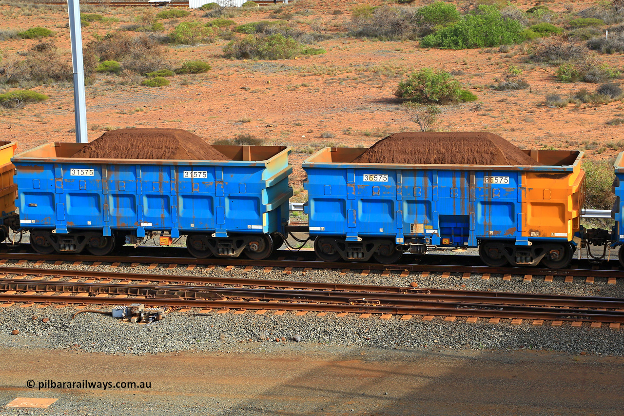 240619 0352
Cape Lambert yard, one of Rio Tinto's blue rakes with spring park brake and only electronic controlled pneumatic [ECP] braking, waggon pair 31575 is a master and is bar coupled to slave waggon 36575 built by China Northen as a Q type in 12/2022. Captured on June 19, 2024.
Keywords: 31575;36575;Q-type;China-Northern;Rio-ore-waggon;