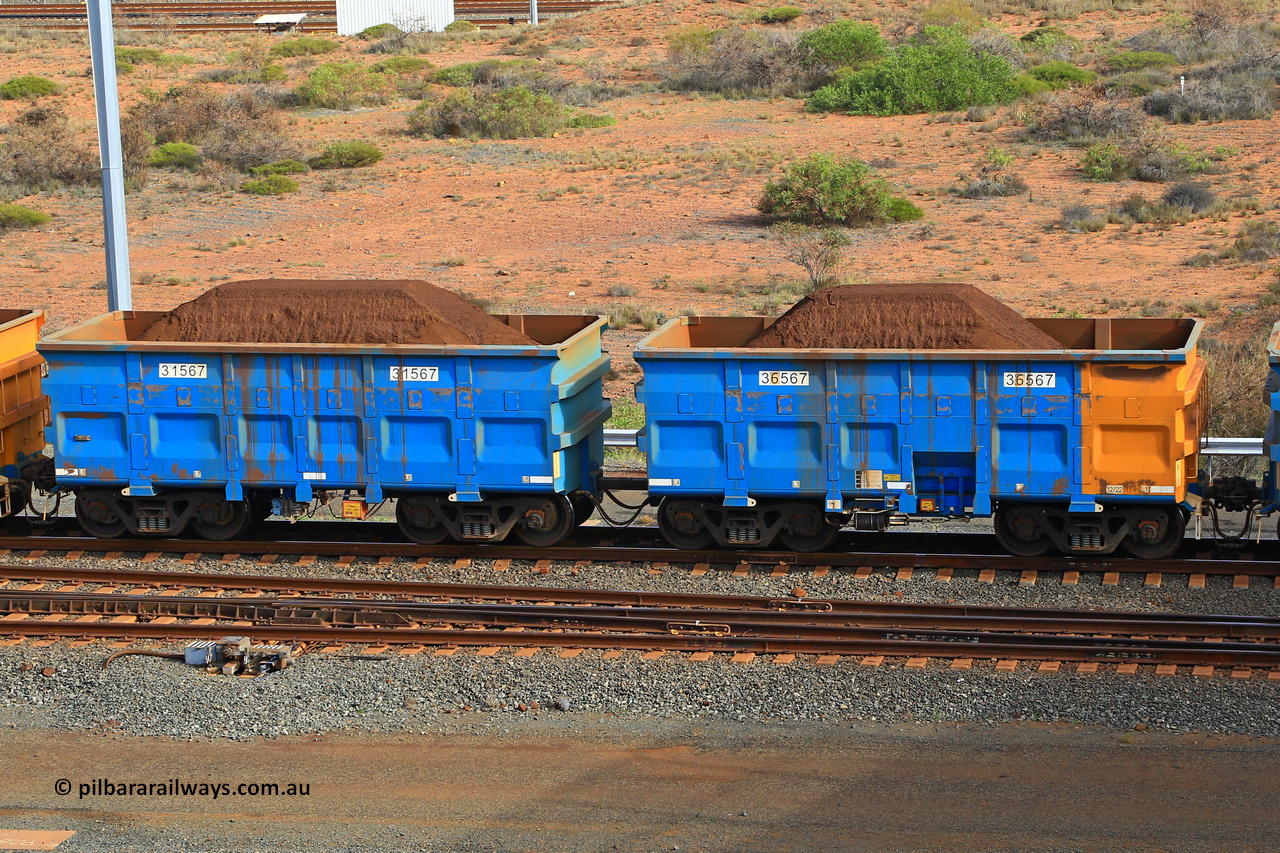 240619 0355
Cape Lambert yard, one of Rio Tinto's blue rakes with spring park brake and only electronic controlled pneumatic [ECP] braking, waggon pair 31567 is a master and is bar coupled to slave waggon 36567 built by China Northen as a Q type in 12/2022. Captured on June 19, 2024.
Keywords: 31567;36567;Q-type;China-Northern;Rio-ore-waggon;