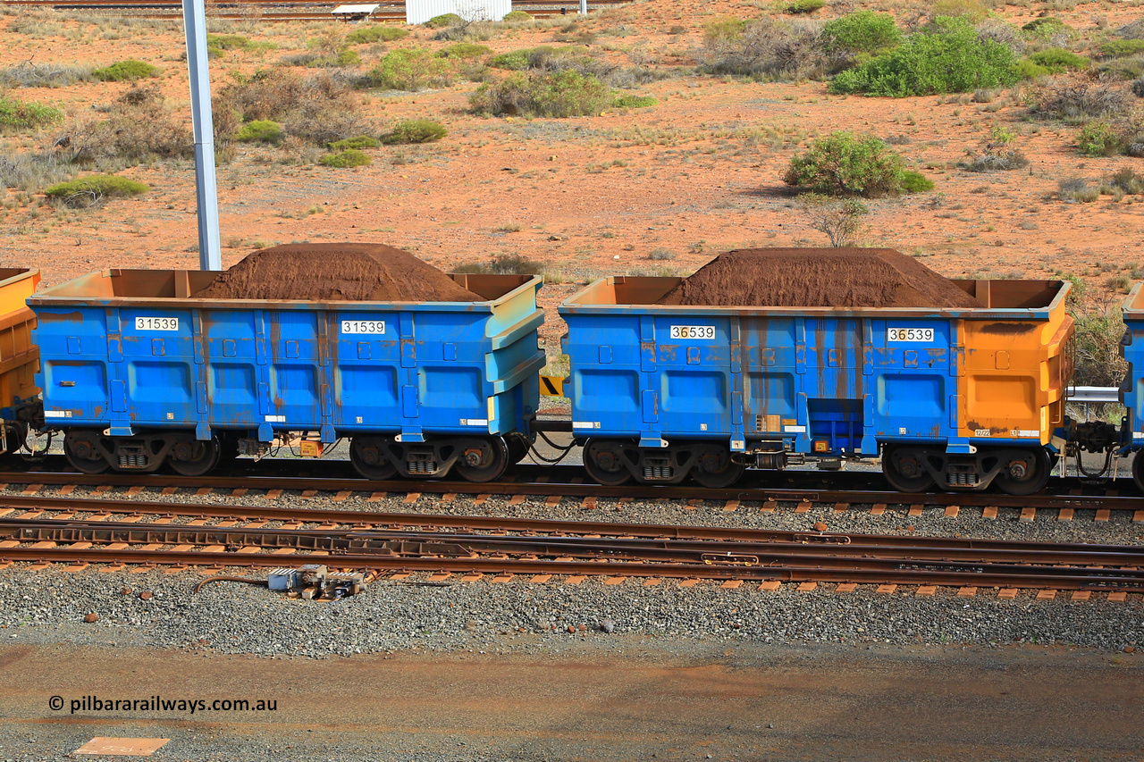 240619 0356
Cape Lambert yard, one of Rio Tinto's blue rakes with spring park brake and only electronic controlled pneumatic [ECP] braking, waggon pair 31539 is a master and is bar coupled to slave waggon 36539 built by China Northen as a Q type in 12/2022. Captured on June 19, 2024.
Keywords: 31539;36539;Q-type;China-Northern;Rio-ore-waggon;