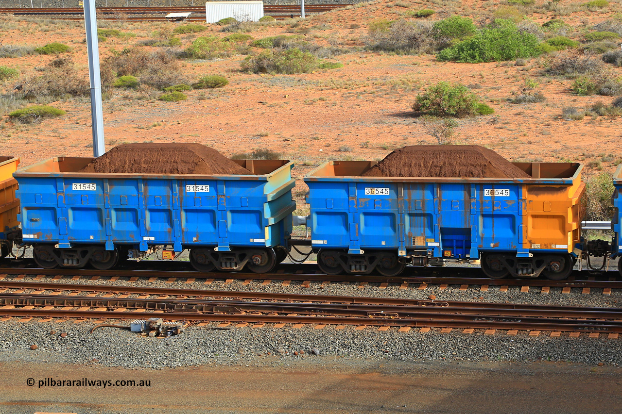 240619 0357
Cape Lambert yard, one of Rio Tinto's blue rakes with spring park brake and only electronic controlled pneumatic [ECP] braking, waggon pair 31545 is a master and is bar coupled to slave waggon 36545 built by China Northen as a Q type in 12/2022. Captured on June 19, 2024.
Keywords: 31545;36545;Q-type;China-Northern;Rio-ore-waggon;