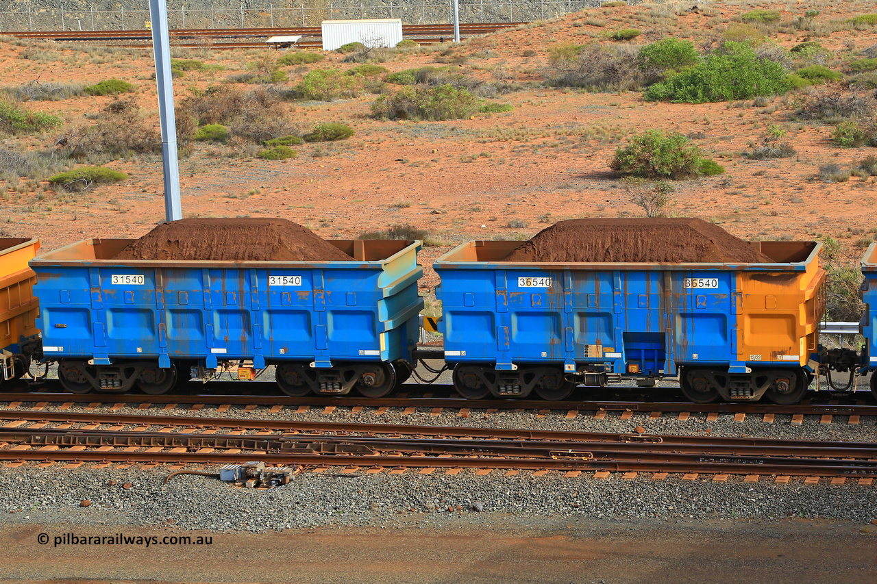 240619 0362
Cape Lambert yard, one of Rio Tinto's blue rakes with spring park brake and only electronic controlled pneumatic [ECP] braking, waggon pair 31540 is a master and is bar coupled to slave waggon 36540 built by China Northen as a Q type in 12/2022. Captured on June 19, 2024.
Keywords: 31540;36540;Q-type;China-Northern;Rio-ore-waggon;