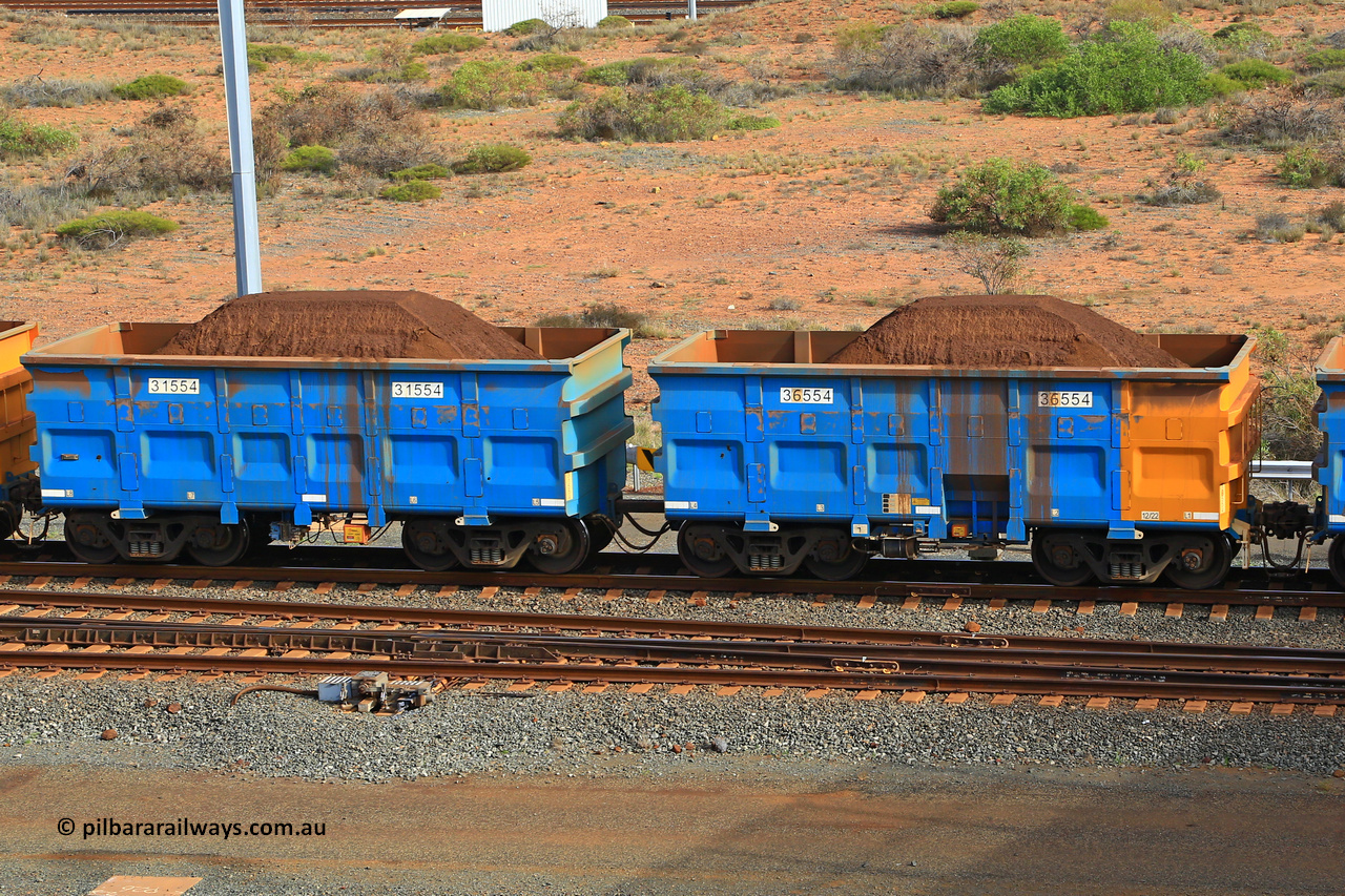 240619 0368
Cape Lambert yard, one of Rio Tinto's blue rakes with spring park brake and only electronic controlled pneumatic [ECP] braking, waggon pair 31554 is a master and is bar coupled to slave waggon 36554 built by China Northen as a Q type in 12/2022. Captured on June 19, 2024.
Keywords: 31554;36554;Q-type;China-Northern;Rio-ore-waggon;