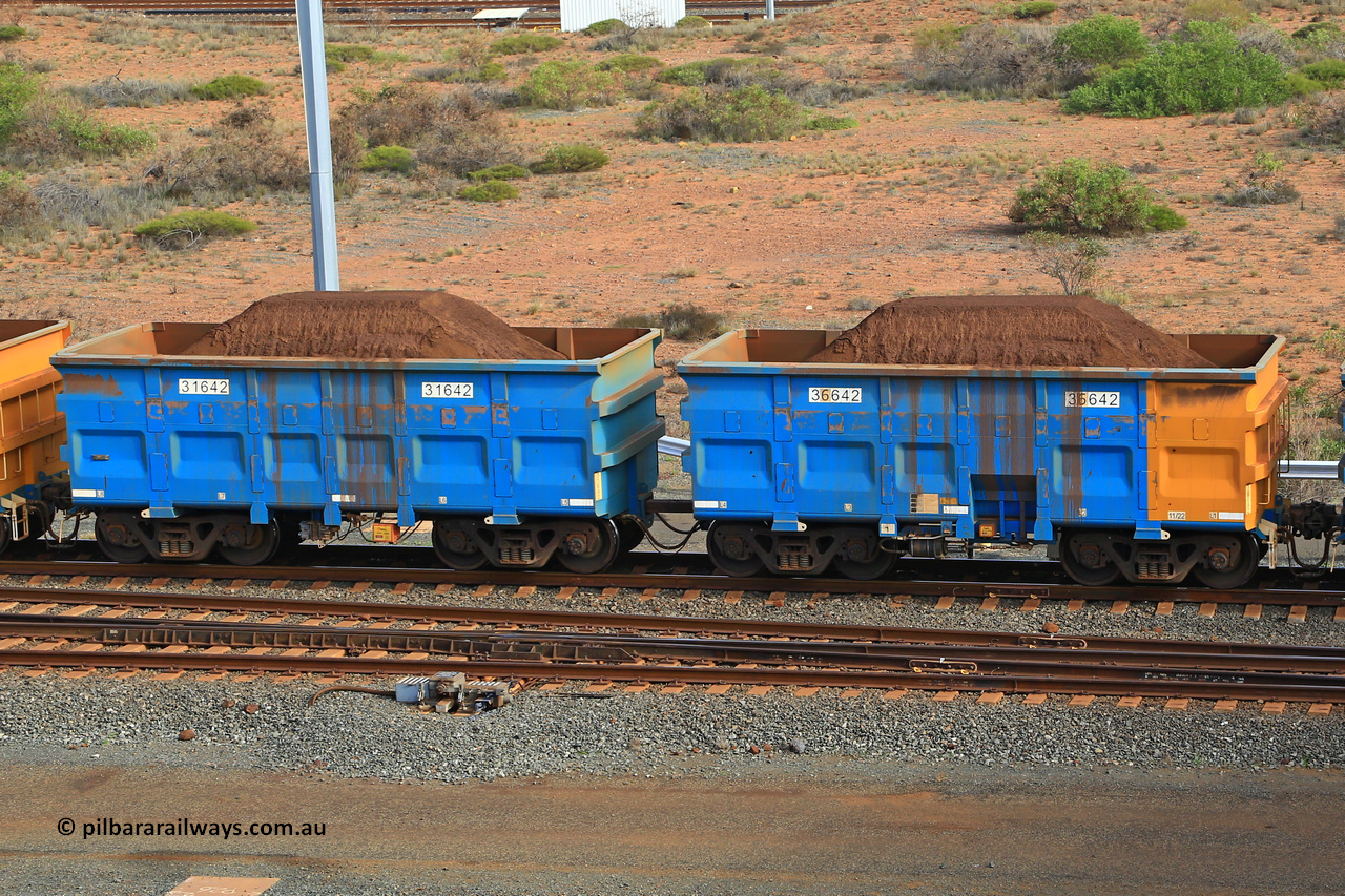 240619 0372
Cape Lambert yard, one of Rio Tinto's blue rakes with spring park brake and only electronic controlled pneumatic [ECP] braking, waggon pair 31642 is a master and is bar coupled to slave waggon 36642 built by China Northen as a Q type in 11/2022. Captured on June 19, 2024.
Keywords: 31642;36642;Q-type;China-Northern;Rio-ore-waggon;
