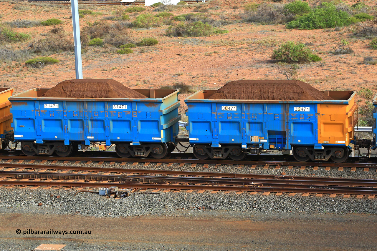 240619 0375
Cape Lambert yard, one of Rio Tinto's blue rakes with spring park brake and only electronic controlled pneumatic [ECP] braking, waggon pair 31471 is a master and is bar coupled to slave waggon 36471 built by China Northen as a Q type in 12/2022. Captured on June 19, 2024.
Keywords: 31471;36471;Q-type;China-Northern;Rio-ore-waggon;