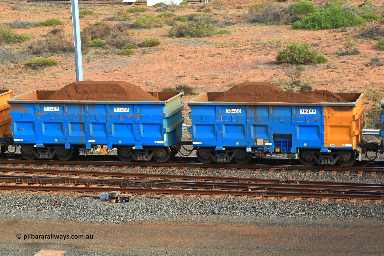 240619 0377
Cape Lambert yard, one of Rio Tinto's blue rakes with spring park brake and only electronic controlled pneumatic [ECP] braking, waggon pair 31488 is a master and is bar coupled to slave waggon 36488 built by China Northen as a Q type in 12/2022. Captured on June 19, 2024.
Keywords: 31488;36488;Q-type;China-Northern;Rio-ore-waggon;