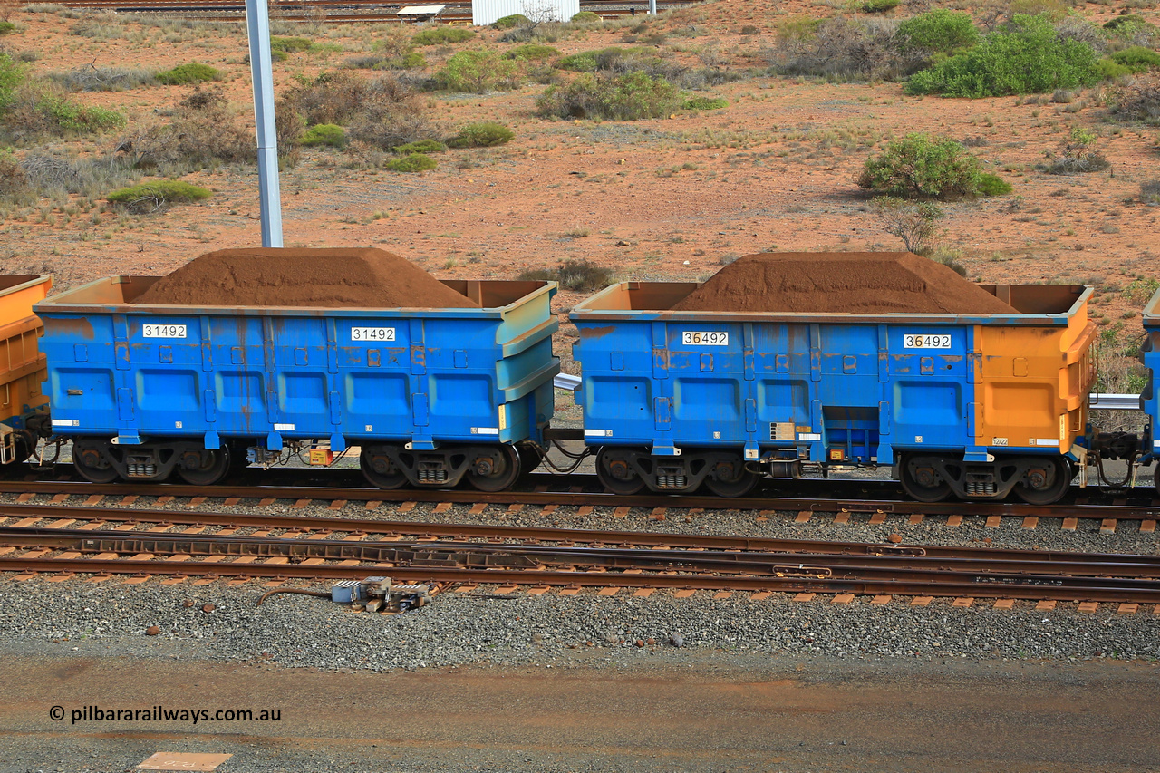 240619 0378
Cape Lambert yard, one of Rio Tinto's blue rakes with spring park brake and only electronic controlled pneumatic [ECP] braking, waggon pair 31492 is a master and is bar coupled to slave waggon 36492 built by China Northen as a Q type in 12/2022. Captured on June 19, 2024.
Keywords: 31492;36492;Q-type;China-Northern;Rio-ore-waggon;