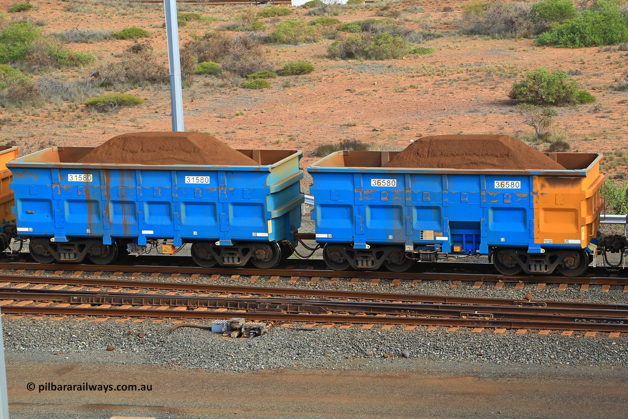 240619 0381
Cape Lambert yard, one of Rio Tinto's blue rakes with spring park brake and only electronic controlled pneumatic [ECP] braking, waggon pair 31580 is a master and is bar coupled to slave waggon 36580 built by China Northen as a Q type in 12/2022. Captured on June 19, 2024.
Keywords: 31580;36580;Q-type;China-Northern;Rio-ore-waggon;