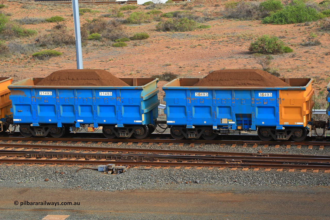 240619 0385
Cape Lambert yard, one of Rio Tinto's blue rakes with spring park brake and only electronic controlled pneumatic [ECP] braking, waggon pair 31493 is a master and is bar coupled to slave waggon 36493 built by China Northen as a Q type in 12/2022. Captured on June 19, 2024.
Keywords: 31493;36493;Q-type;China-Northern;Rio-ore-waggon;