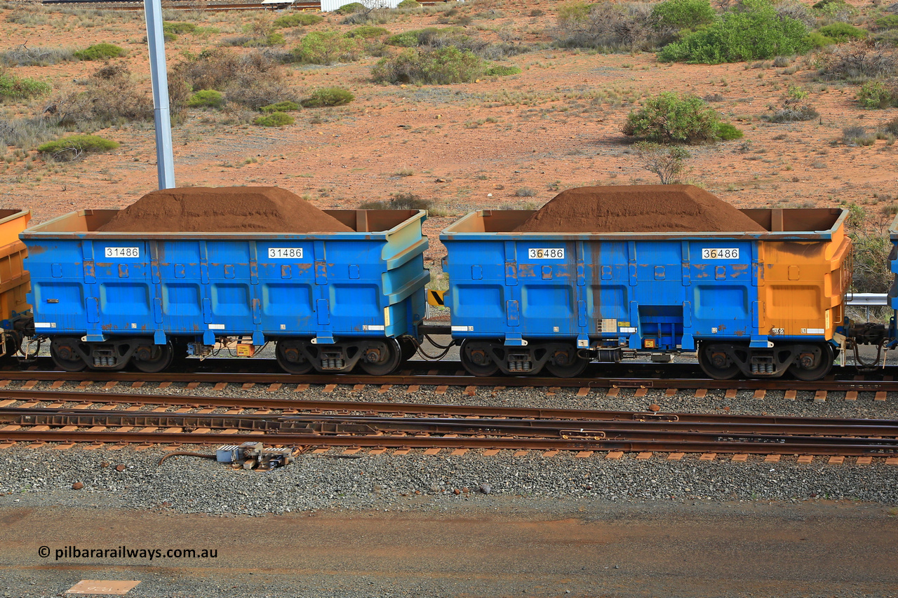 240619 0386
Cape Lambert yard, one of Rio Tinto's blue rakes with spring park brake and only electronic controlled pneumatic [ECP] braking, waggon pair 31486 is a master and is bar coupled to slave waggon 36486 built by China Northen as a Q type in 12/2022. Captured on June 19, 2024.
Keywords: 31486;36486;Q-type;China-Northern;Rio-ore-waggon;