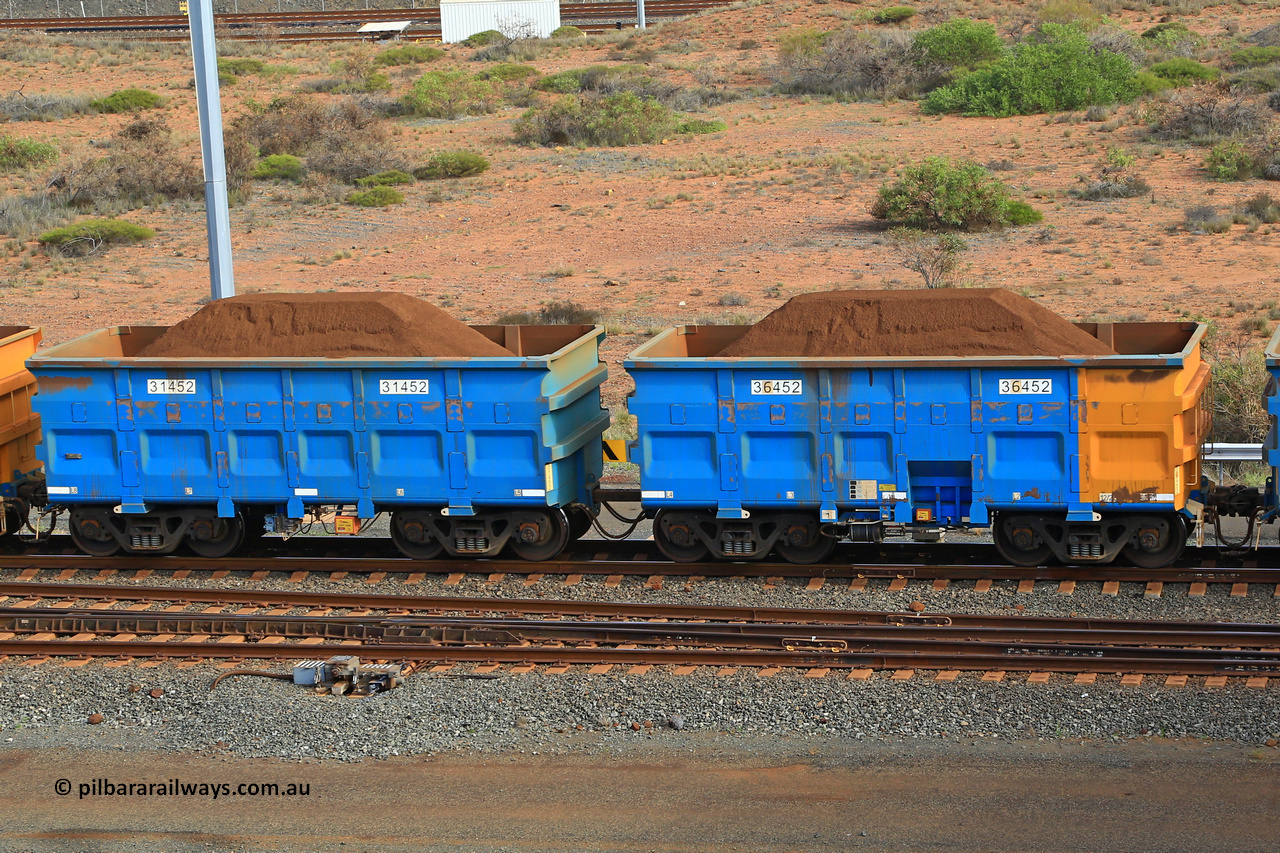 240619 0387
Cape Lambert yard, one of Rio Tinto's blue rakes with spring park brake and only electronic controlled pneumatic [ECP] braking, waggon pair 31452 is a master and is bar coupled to slave waggon 36452 built by China Northen as a Q type in 12/2022. Captured on June 19, 2024.
Keywords: 31452;36452;Q-type;China-Northern;Rio-ore-waggon;