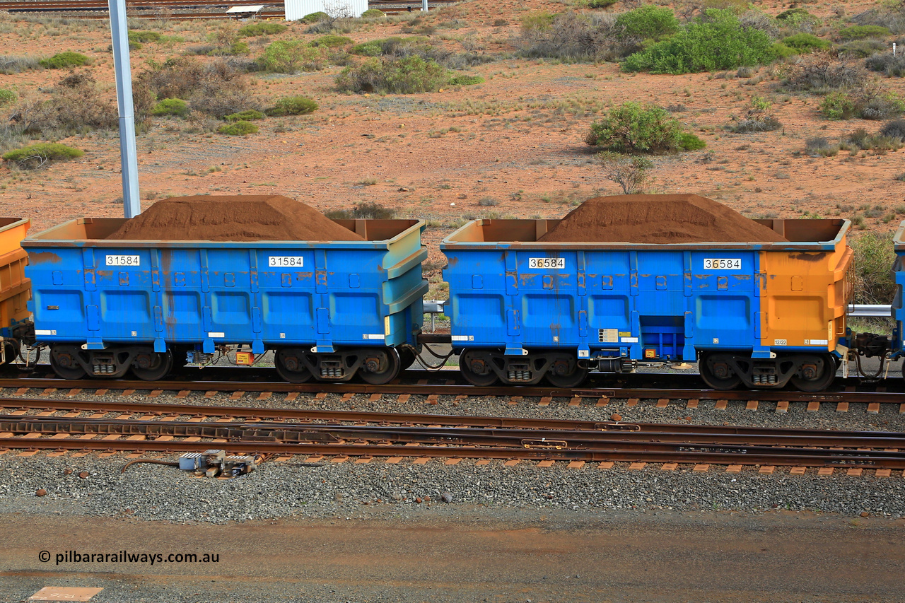 240619 0393
Cape Lambert yard, one of Rio Tinto's blue rakes with spring park brake and only electronic controlled pneumatic [ECP] braking, waggon pair 31584 is a master and is bar coupled to slave waggon 36584 built by China Northen as a Q type in 12/2022. Captured on June 19, 2024.
Keywords: 31584;36584;Q-type;China-Northern;Rio-ore-waggon;