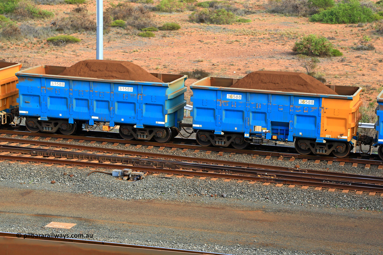 240619 0402
Cape Lambert yard, one of Rio Tinto's blue rakes with spring park brake and only electronic controlled pneumatic [ECP] braking, waggon pair 31588 is a master and is bar coupled to slave waggon 36588 built by China Northen as a Q type in 11/2022. Captured on June 19, 2024.
Keywords: 31588;36588;Q-type;China-Northern;Rio-ore-waggon;