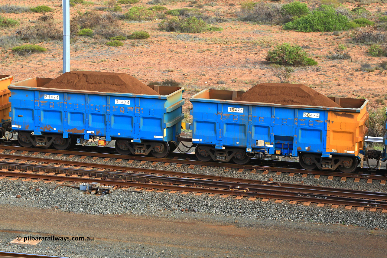 240619 0406
Cape Lambert yard, one of Rio Tinto's blue rakes with spring park brake and only electronic controlled pneumatic [ECP] braking, waggon pair 31474 is a master and is bar coupled to slave waggon 36474 built by China Northen as a Q type in 12/2022. Captured on June 19, 2024.
Keywords: 31474;36474;Q-type;China-Northern;Rio-ore-waggon;