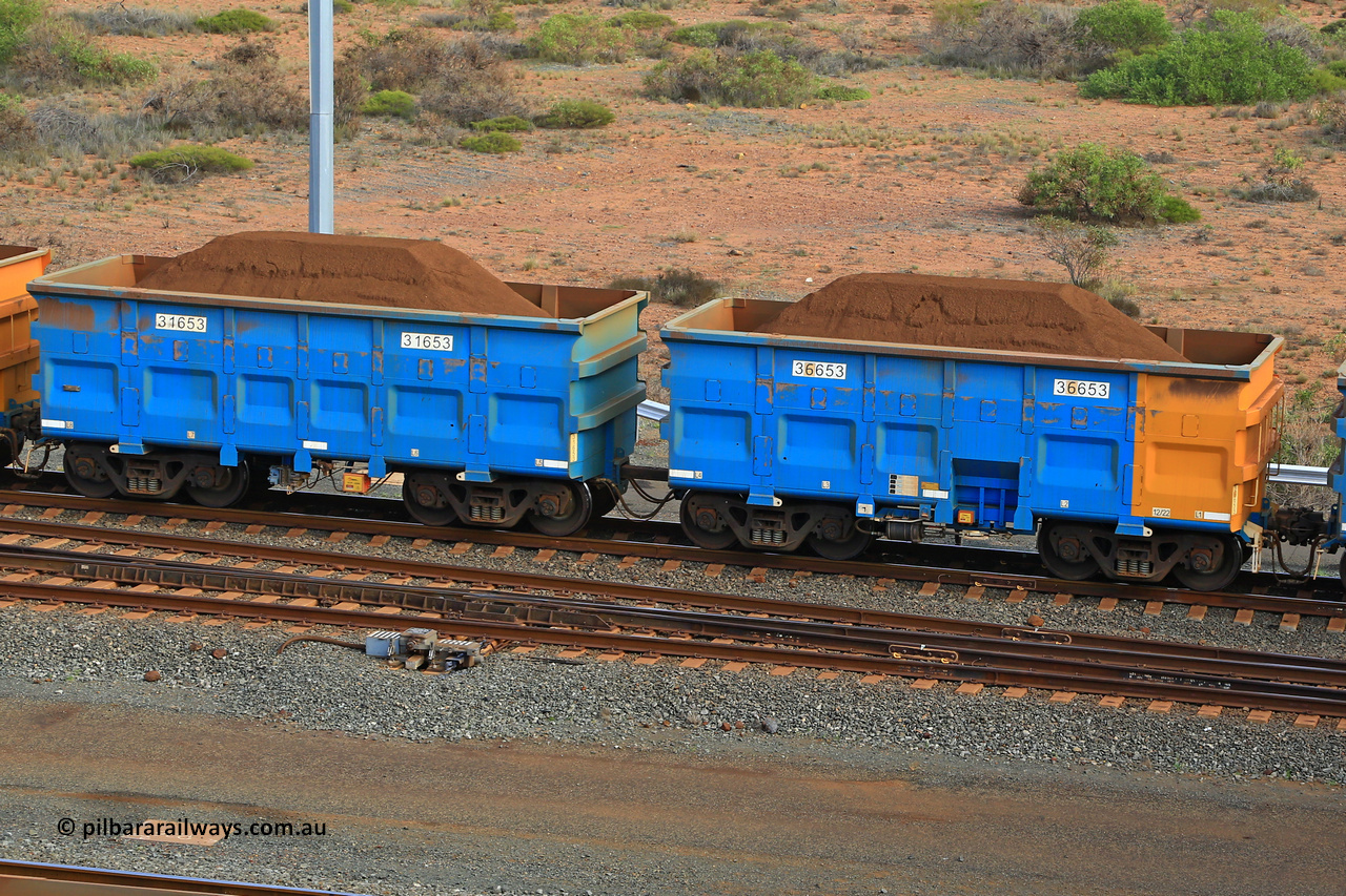 240619 0411
Cape Lambert yard, one of Rio Tinto's blue rakes with spring park brake and only electronic controlled pneumatic [ECP] braking, waggon pair 31653 is a master and is bar coupled to slave waggon 36653 built by China Northen as a Q type in 12/2022. Captured on June 19, 2024.
Keywords: 31653;36653;Q-type;China-Northern;Rio-ore-waggon;