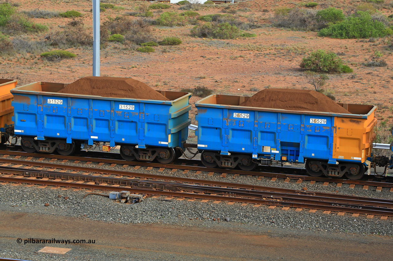240619 0412
Cape Lambert yard, one of Rio Tinto's blue rakes with spring park brake and only electronic controlled pneumatic [ECP] braking, waggon pair 31529 is a master and is bar coupled to slave waggon 36529 built by China Northen as a Q type in 12/2022. Captured on June 19, 2024.
Keywords: 31529;36529;Q-type;China-Northern;Rio-ore-waggon;