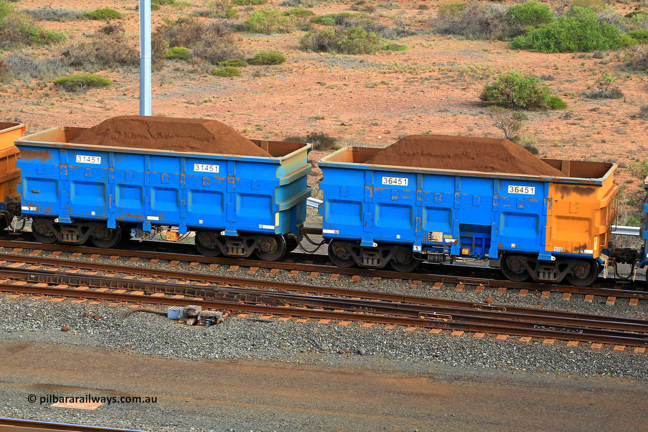 240619 0418
Cape Lambert yard, one of Rio Tinto's blue rakes with spring park brake and only electronic controlled pneumatic [ECP] braking, waggon pair 31451 is a master and is bar coupled to slave waggon 36451 built by China Northen as a Q type in 12/2022. Captured on June 19, 2024.
Keywords: 31451;36451;Q-type;China-Northern;Rio-ore-waggon;
