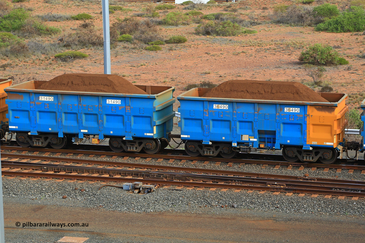 240619 0428
Cape Lambert yard, one of Rio Tinto's blue rakes with spring park brake and only electronic controlled pneumatic [ECP] braking, waggon pair 31490 is a master and is bar coupled to slave waggon 36490 built by China Northen as a Q type in 12/2022. Captured on June 19, 2024.
Keywords: 31490;36490;Q-type;China-Northern;Rio-ore-waggon;