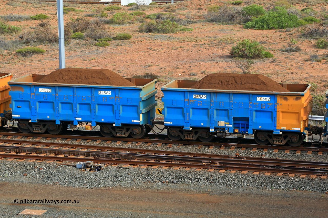 240619 0431
Cape Lambert yard, one of Rio Tinto's blue rakes with spring park brake and only electronic controlled pneumatic [ECP] braking, waggon pair 31582 is a master and is bar coupled to slave waggon 36582 built by China Northen as a Q type in 12/2022. Captured on June 19, 2024.
Keywords: 31582;36582;Q-type;China-Northern;Rio-ore-waggon;