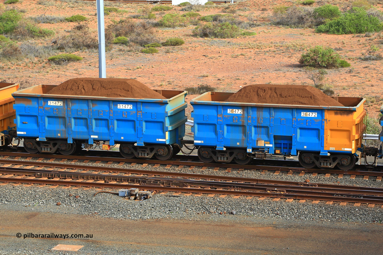 240619 0436
Cape Lambert yard, one of Rio Tinto's blue rakes with spring park brake and only electronic controlled pneumatic [ECP] braking, waggon pair 31472 is a master and is bar coupled to slave waggon 36472 built by China Northen as a Q type in 12/2022. Captured on June 19, 2024.
Keywords: 31472;36472;Q-type;China-Northern;Rio-ore-waggon;