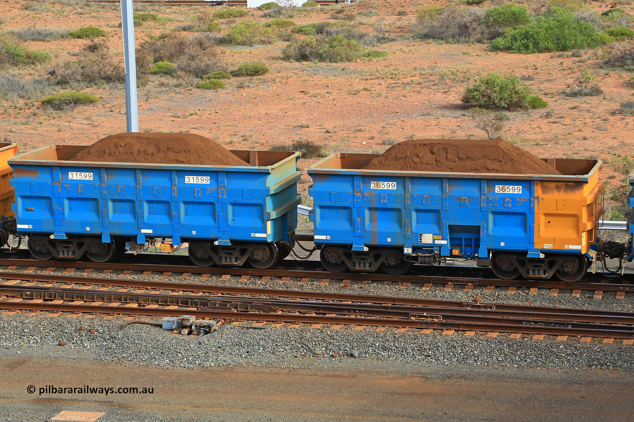 240619 0447
Cape Lambert yard, one of Rio Tinto's blue rakes with spring park brake and only electronic controlled pneumatic [ECP] braking, waggon pair 31599 is a master and is bar coupled to slave waggon 36599 built by China Northen as a Q type in 11/2022. Captured on June 19, 2024.
Keywords: 31599;36599;Q-type;China-Northern;Rio-ore-waggon;