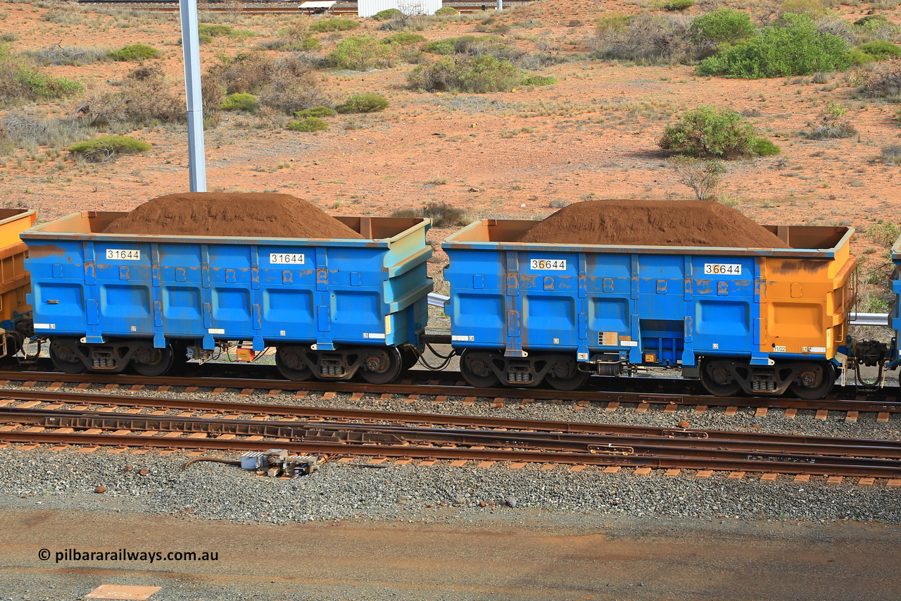 240619 0453
Cape Lambert yard, one of Rio Tinto's blue rakes with spring park brake and only electronic controlled pneumatic [ECP] braking, waggon pair 31644 is a master and is bar coupled to slave waggon 36644 built by China Northen as a Q type in 11/2022. Captured on June 19, 2024.
Keywords: 31644;36644;Q-type;China-Northern;Rio-ore-waggon;
