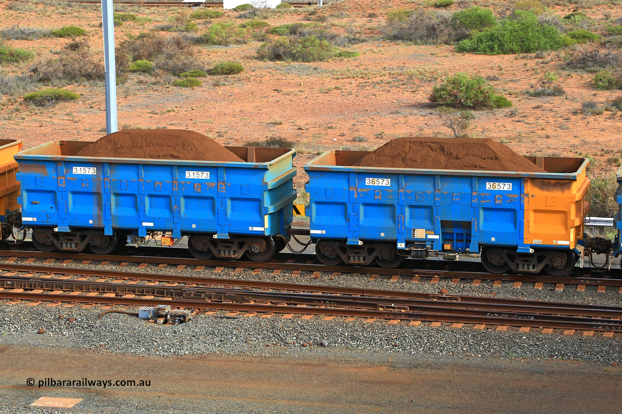 240619 0455
Cape Lambert yard, one of Rio Tinto's blue rakes with spring park brake and only electronic controlled pneumatic [ECP] braking, waggon pair 31573 is a master and is bar coupled to slave waggon 36573 built by China Northen as a Q type in 12/2022. Captured on June 19, 2024.
Keywords: 31573;36573;Q-type;China-Northern;Rio-ore-waggon;