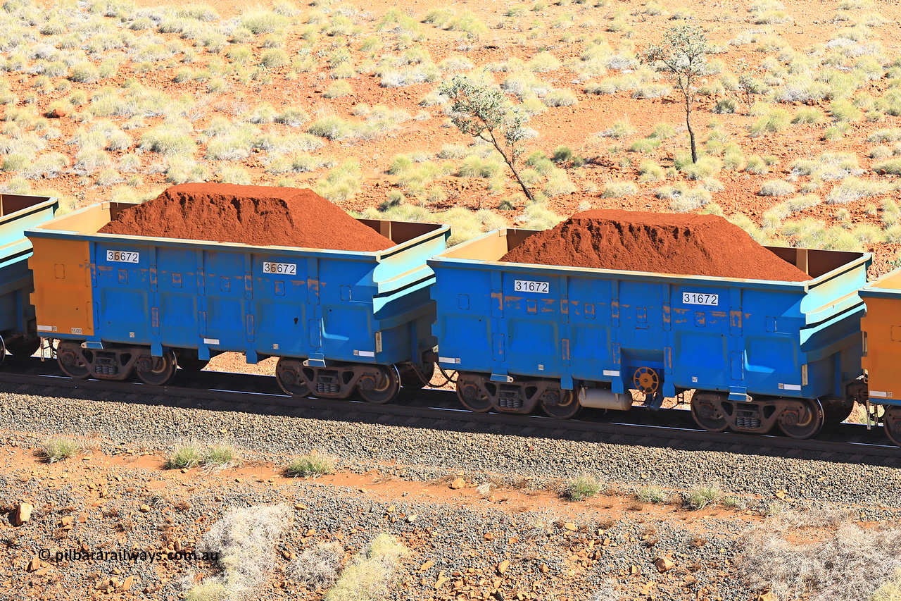 240701 2441
Western Creek, 67 km, one of Rio Tinto's blue rakes with spring assisted park brake and only electronic controlled pneumatic [ECP] braking, waggon pair 31672 is a master and is bar coupled to slave waggon 36672 built by China Northen as a Q type in 11/2022. Captured on July 1, 2024.
Keywords: 31672;36672;Q-type;China-Northern;Rio-ore-waggon;