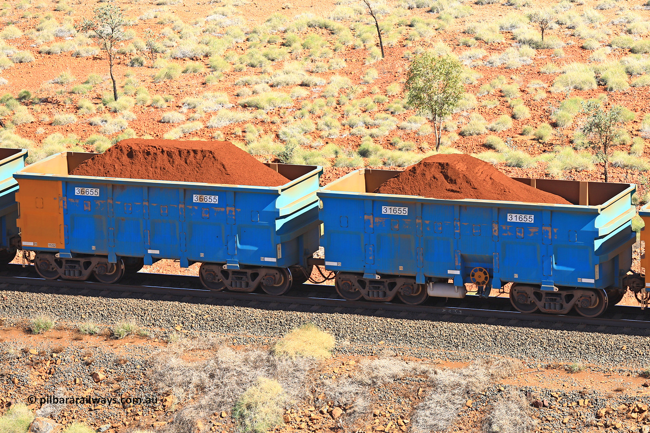 240701 2450
Western Creek, 67 km, one of Rio Tinto's blue rakes with spring assisted park brake and only electronic controlled pneumatic [ECP] braking, waggon pair 31655 is a master and is bar coupled to slave waggon 36655 built by China Northen as a Q type in 11/2022. Captured on July 1, 2024.
Keywords: 31655;36655;Q-type;China-Northern;Rio-ore-waggon;