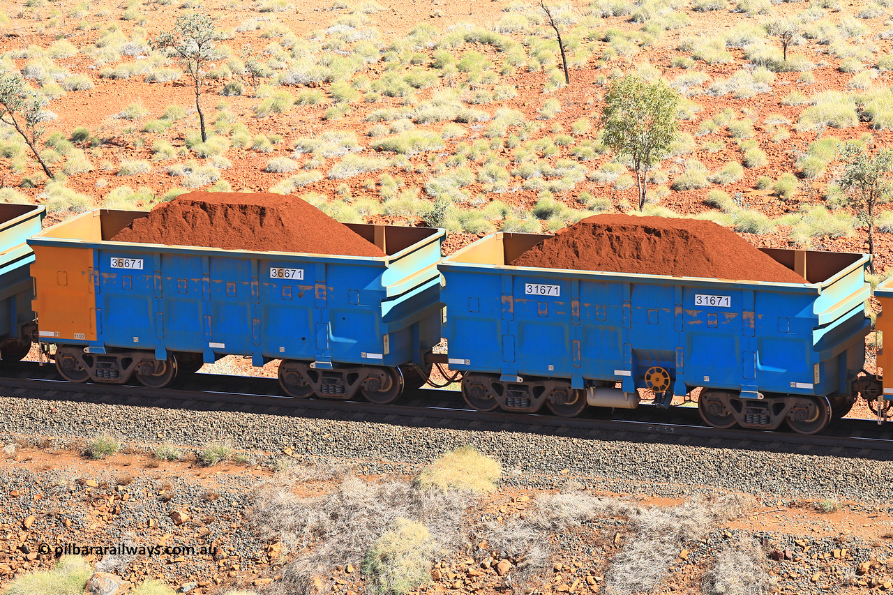 240701 2455
Western Creek, 67 km, one of Rio Tinto's blue rakes with spring assisted park brake and only electronic controlled pneumatic [ECP] braking, waggon pair 31671 is a master and is bar coupled to slave waggon 36671 built by China Northen as a Q type in 11/2022. Captured on July 1, 2024.
Keywords: 31671;36671;Q-type;China-Northern;Rio-ore-waggon;