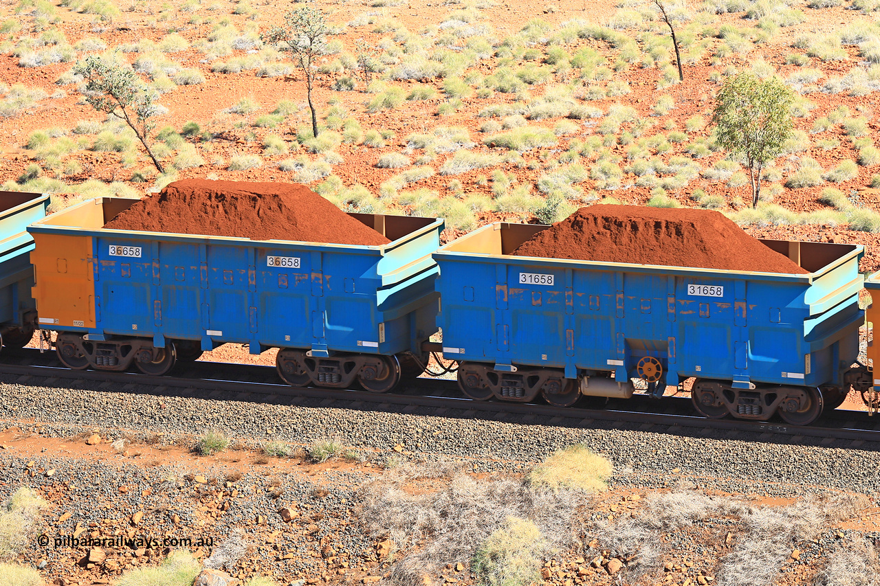 240701 2461
Western Creek, 67 km, one of Rio Tinto's blue rakes with spring assisted park brake and only electronic controlled pneumatic [ECP] braking, waggon pair 31658 is a master and is bar coupled to slave waggon 36658 built by China Northen as a Q type in 11/2022. Captured on July 1, 2024.
Keywords: 31658;36658;Q-type;China-Northern;Rio-ore-waggon;