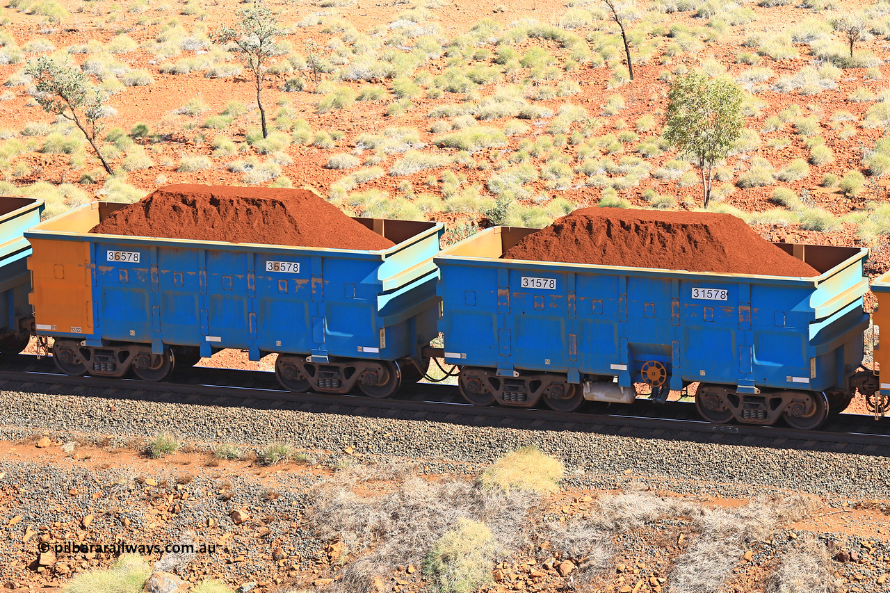 240701 2492
Western Creek, 67 km, one of Rio Tinto's blue rakes with spring assisted park brake and only electronic controlled pneumatic [ECP] braking, waggon pair 31578 is a master and is bar coupled to slave waggon 36578 built by China Northen as a Q type in 12/2022. Captured on July 1, 2024.
Keywords: 31578;36578;Q-type;China-Northern;Rio-ore-waggon;