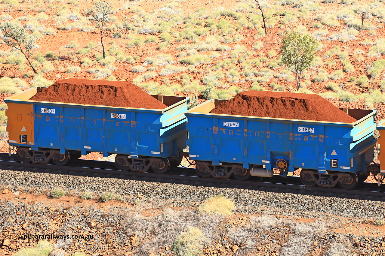 240701 2504
Western Creek, 67 km, one of Rio Tinto's blue rakes with spring assisted park brake and only electronic controlled pneumatic [ECP] braking, waggon pair 31687 is a master and is bar coupled to slave waggon 36687 built by China Northen as a Q type in 11/2022. Captured on July 1, 2024.
Keywords: 31687;36687;Q-type;China-Northern;Rio-ore-waggon;