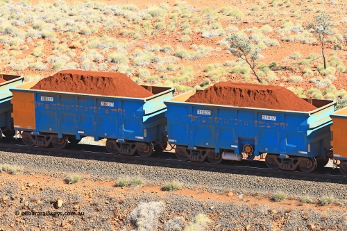240701 2437
Western Creek, 67 km, one of Rio Tinto's blue rakes with spring assisted park brake and only electronic controlled pneumatic [ECP] braking, waggon pair 31637 is a master and is bar coupled to slave waggon 36637 built by China Northen as a Q type in 11/2022. Captured on July 1, 2024.
Keywords: 31637;36637;Q-type;China-Northern;Rio-ore-waggon;