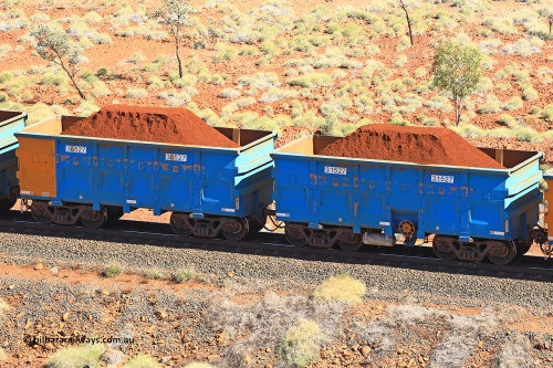 240701 2474
Western Creek, 67 km, one of Rio Tinto's blue rakes with spring assisted park brake and only electronic controlled pneumatic [ECP] braking, waggon pair 31527 is a master and is bar coupled to slave waggon 36527 built by China Northen as a Q type in 12/2022. Captured on July 1, 2024.
Keywords: 31527;36527;Q-type;China-Northern;Rio-ore-waggon;