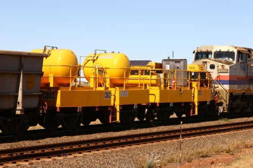 CB03 060715 6950
Rio Tinto compressor waggon set CB 03, compressor control waggon with two diesel powered Atlas Copco XAS 97's behind the loco and the receiver waggon with two air tanks or receivers closet to camera. Note the waggons are cut down ore waggons. Seen here just outside of 7 Mile. July 15, 2006.
Keywords: CB03;rio-compressor-waggon;