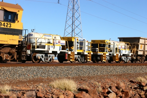 IC-7 060723 7684
Original Hamersley Iron compressor waggon sets IC-6 and IC-7 which were made from cutting down condemned ore waggons and then fitting Atlas Copco XAS 97 air compressors, receiver tanks and fuel tanks. Seen here on the causeway just outside 7 Mile. July 23, 2006.
Keywords: IC-6;IC-7;rio-compressor-waggon;