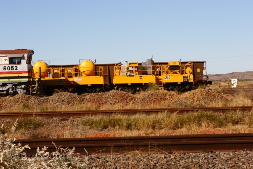 CB02 060723 7828
Rio Tinto compressor waggon set CB 02, compressor control waggon with two diesel powered Atlas Copco XAS 97's and the receiver waggon with two air tanks or receivers. Note the waggons are cut down ore waggons. Seen here inside 7 Mile. July 23, 2006.
Keywords: CB02;rio-compressor-waggon;