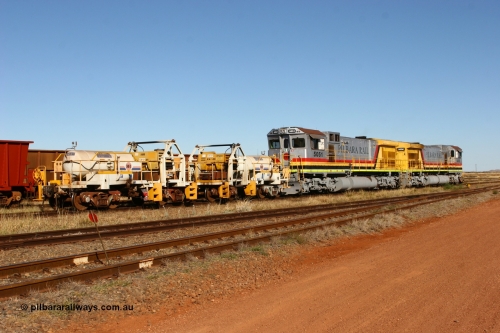 IC-1 060723 7846
Original Hamersley Iron compressor waggon sets IC-1 and IC-3 which were made from cutting down condemned ore waggons and then fitting Atlas Copco XAS 97 air compressors, receiver tanks and fuel tanks. The compressors have been fitted to a swing cradle to limit the in-train forces during the unloading process. 7 Mile July 23, 2006.
Keywords: IC-1;IC-3;rio-compressor-waggon;
