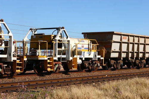IC-1 060724 7865
Original Hamersley Iron compressor waggon set IC-1 which were made from cutting down condemned ore waggons and then fitting Atlas Copco XAS 97 air compressors, receiver tanks and fuel tanks. The compressors have been fitted to a swing cradle to limit the in-train forces during the unloading process. 7 Mile 24th July 2006.
Keywords: IC-1;rio-compressor-waggon;