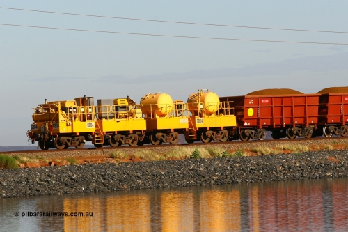 CB04 110602 8604
Rio Tinto compressor waggon set CB 04, compressor control waggon with two diesel powered Atlas Copco XAS 97's and the receiver waggon with two air tanks or receivers. Note the waggons are cut down ore waggons. Seen here on the causeway just outside of 7 Mile. June 2, 2011.
Keywords: CB04;rio-compressor-waggon;