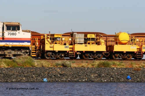 CB03 110602 8646
Rio Tinto compressor waggon set CB 03, compressor control waggon with two diesel powered Atlas Copco XAS 97's behind the loco. Note these waggons are cut down ore waggons. Seen here on the causeway just outside of 7 Mile. June 2, 2011.
Keywords: CB03;rio-compressor-waggon;