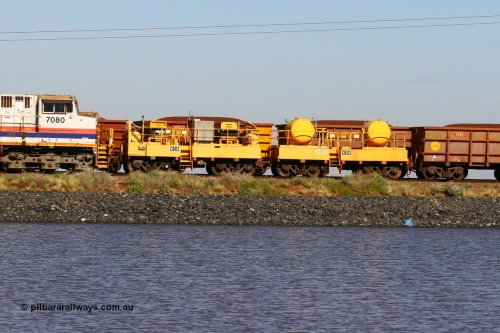 CB03 110602 8648
Rio Tinto compressor waggon set CB 03, compressor control waggon with two diesel powered Atlas Copco XAS 97's behind the loco and the receiver waggon with two air tanks or receivers. Note the waggons are cut down ore waggons. Seen here on the causeway just outside of 7 Mile. June 2, 2011.
Keywords: CB03;rio-compressor-waggon;