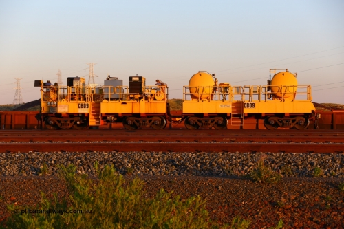 CB09 170510 8282
Rio Tinto compressor waggon set CB 09, compressor control waggon with two diesel powered Kaeser M57 Utility air compressors and the receiver waggon with two air tanks or receivers. Note the waggons are modified ore waggon frames. Seen here at Cape Lambert. May 10, 2017.
Keywords: CB09;rio-compressor-waggon;