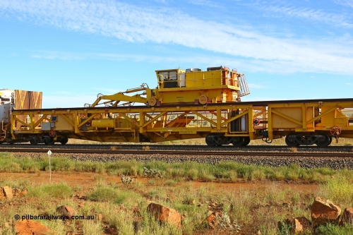RTS001 210510 1119
Near Gull on the Rio Tinto Dampier - Tom Price line at the 101.5 km, RTS type chute and straddle crane carrying rail waggon RTS 001 on Rio Tinto's Gemco Rail built rail train consist. May 10, 2021. [url=https://goo.gl/maps/9WbRn1E4vP6a1YbN8]Location[/url].
Keywords: RTS-type;RTS001;Gemco-Rail-WA