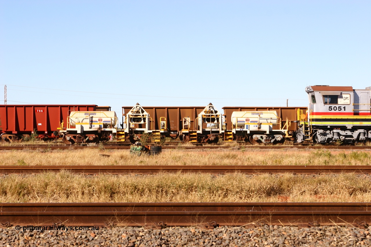 060723 7824
Original Hamersley Iron compressor waggon sets IC-1 and IC-3 which were made from cutting down condemned ore waggons and then fitting Atlas Copco XAS 97 air compressors, receiver tanks and fuel tanks. The compressors have been fitted to a swing cradle to limit the in-train forces during the unloading process. 7 Mile 23rd July 2006.
Keywords: IC-1;IC-3;rio-compressor-waggon;