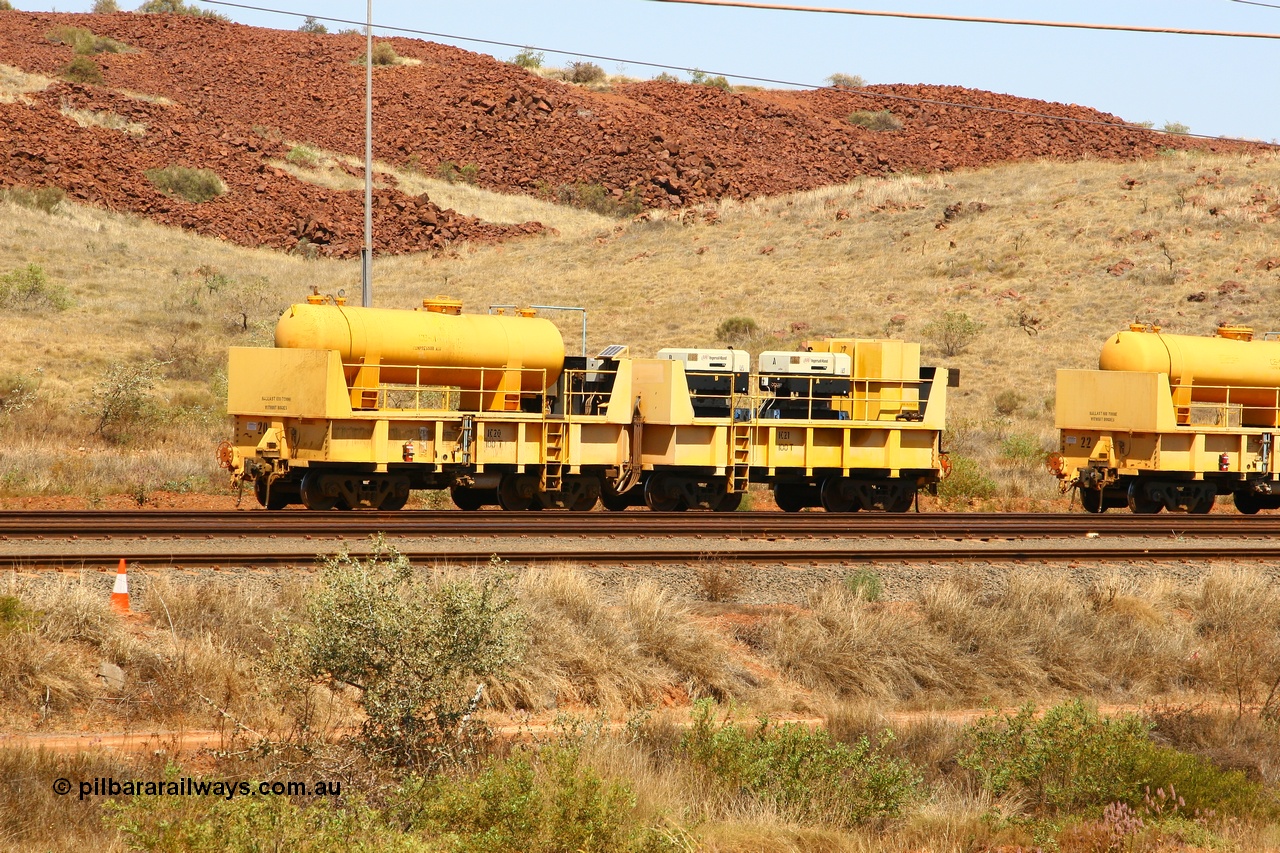 070908 0596
Robe River compressor waggon set IC 20 with air receiver and IC 21 with two Ingersoll Rand air compressors. These waggons are ballasted to 100 tonnes each and are modified ore waggons. Cape Lambert 8th August 2007.
Keywords: IC20;IC21;robe-compressor-waggon;
